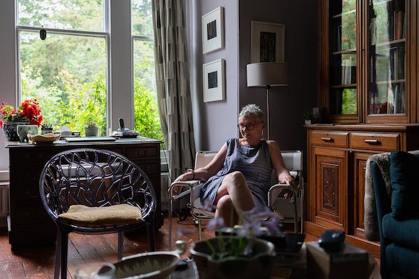 Older woman sat at home