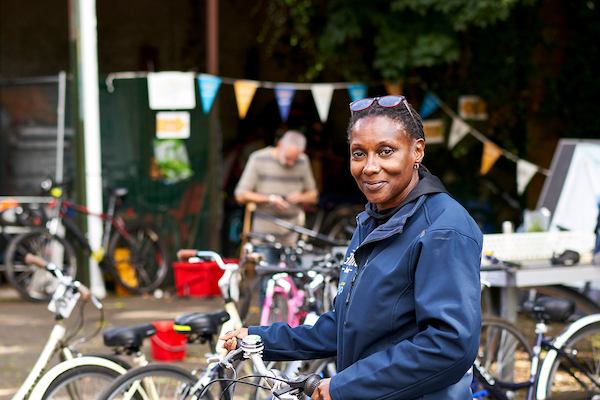 Older woman working with bikes