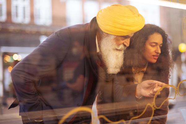 two people looking in a shop window