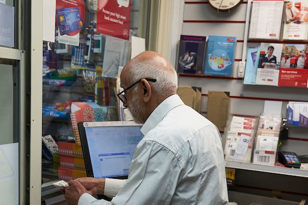 Older-man-working-in-post-office