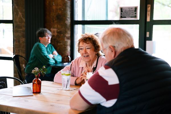 Two-older-people-in-a-cafe