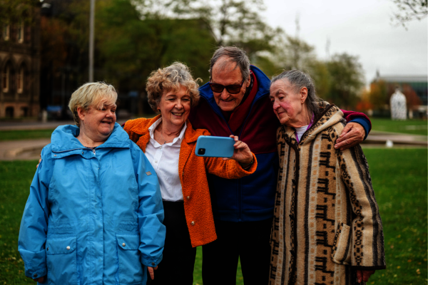A group of older people taking a selfie
