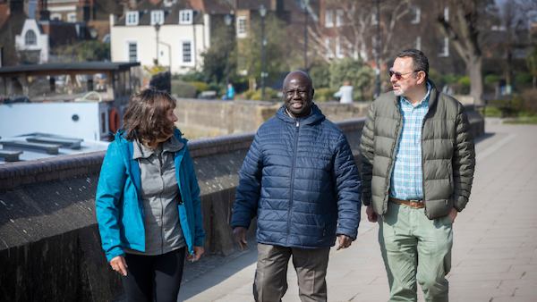 group of older people walking outside